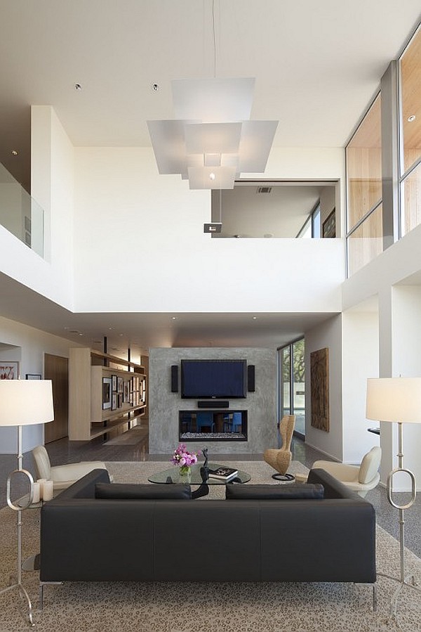Living Room Sofas Cozy Living Room With Black Sofas Facing Glass Table And Led TV With High Ceiling Lamps Which Completed The Room Decor Decoration Artistic High Ceiling Decorating In Bright Room Interior Style