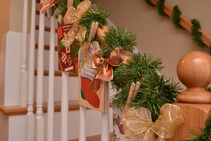 Diy Staircase Idea Creative DIY Staircase Christmas Decor Idea Involving Green Grasses Golden Ribbon And Wishing Lists Or Greeting Card Decoration Magnificent Christmas Decorations On The Staircase Railing