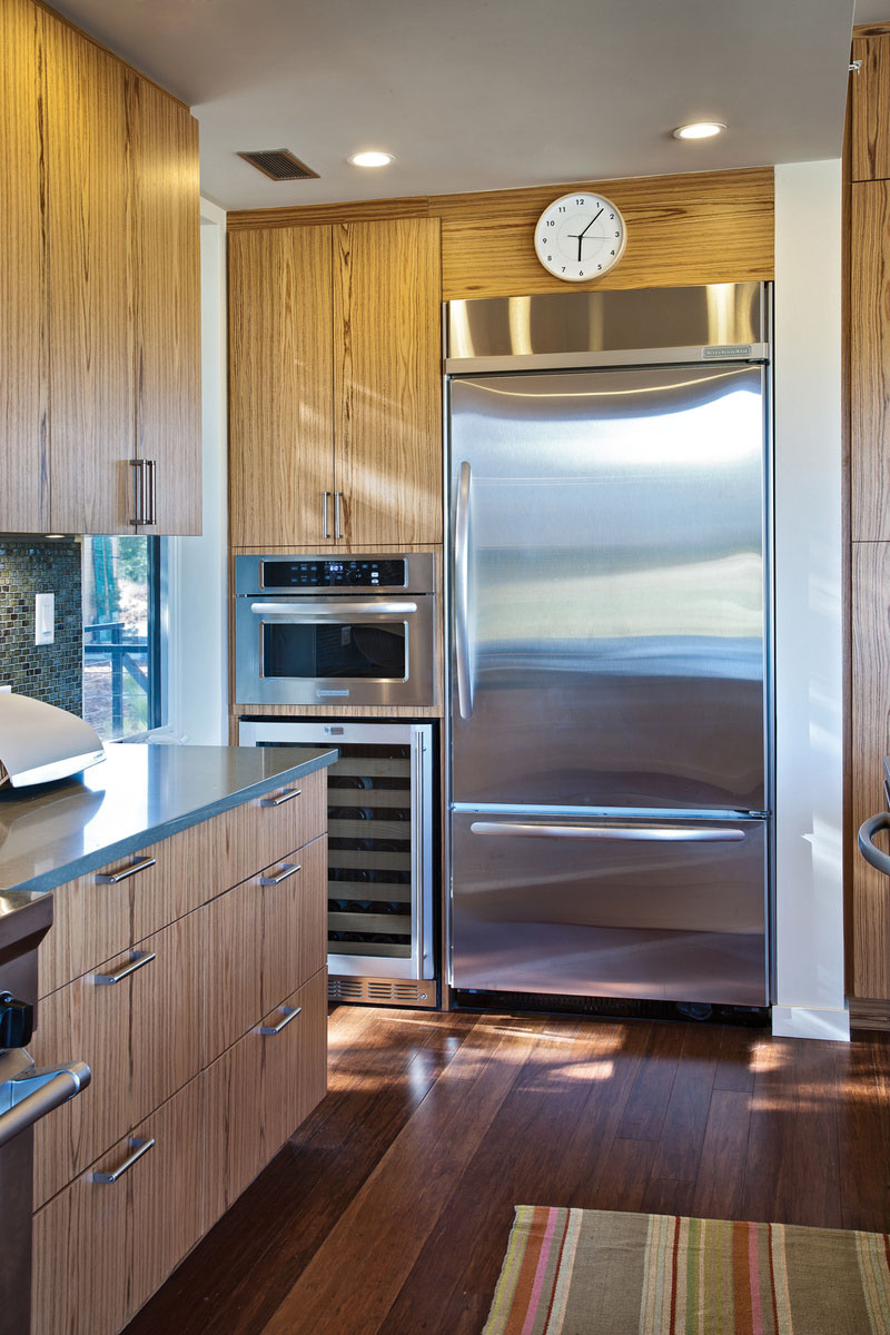 Catching Stainless Such Eye Catching Stainless Steel Appliances Such As Fridge Placed Between Wooden Cabinets In Breeze House Kitchen Architecture  Elegant Spacious Home With Wooden Material And Bright Interior Themes