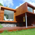 Rounded Wooden The Fantastic Rounded Wooden Stools In The Casa Kolonihagen Norway Wooden Terrace With Stone Wall And Wooden Wall Dream Homes Stunning Holiday House Design As Best Choice For Spending Summer Holiday