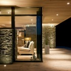 Stone Patterned Wooden Fascinating Stone Patterned Wall And Wooden Glass Windows In The Modern Cabin Design For House Outside The House Decoration Luxurious Beautiful Private Cabin Surrounded By Forest Trees