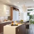 Streamline Kitchen Glossy Fascinating Streamline Kitchen Area With Glossy Cabinets Under The Faucet Feat Washtub And Pendant Lamps Add Pretty The Decor Kitchens Candid Kitchen Cabinet Design In Luminous Contemporary Style