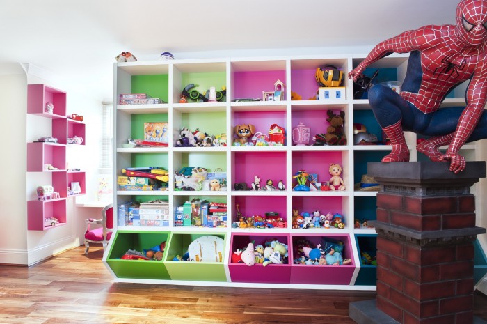 Themed White Childsroom Feminine Themed White Attic Style Child's Room With Pink And Green Storage Cubes And Spider Man On Wooden Floor Kids Room  Cheerful Kid Playroom With Various Themes And Colorful Design