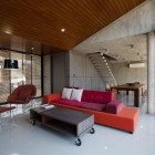 Red Bed Compact Flashy Red Bed Sofa And Compact Shaped Coffee Table With Small Caster Glass Wall Dark Arched Lamp Sleek Laminate Flooring In W House Architecture Elegant Concrete Home With Spacious And Modern Style In Thailand