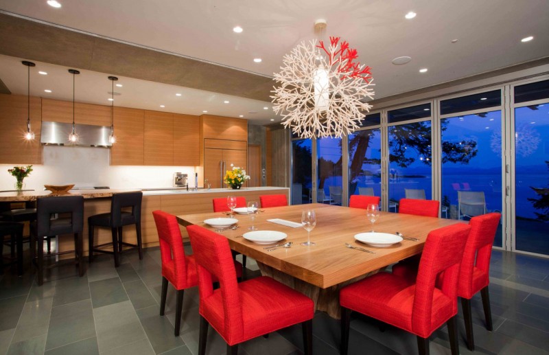 Red Padded Wood Flashy Red Padded Bar Stools Square Wood Dining Table Concrete Floor Lacquered Wood Kitchen Cabinet Shiny Pendant Lights Dark Bar Stools In Pender Harbour House Architecture Stunning Waterfront House With Lush Forest Landscape