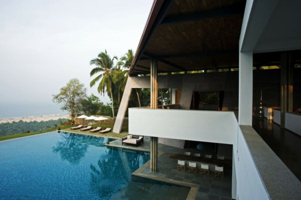 Pool Area And Fresh Pool Area With Loungers And Umbrella Also From Faraway View At The Beautiful Cliff House Area Dream Homes  Spectacular Modern Cliff House With Great Open Infinity Pools