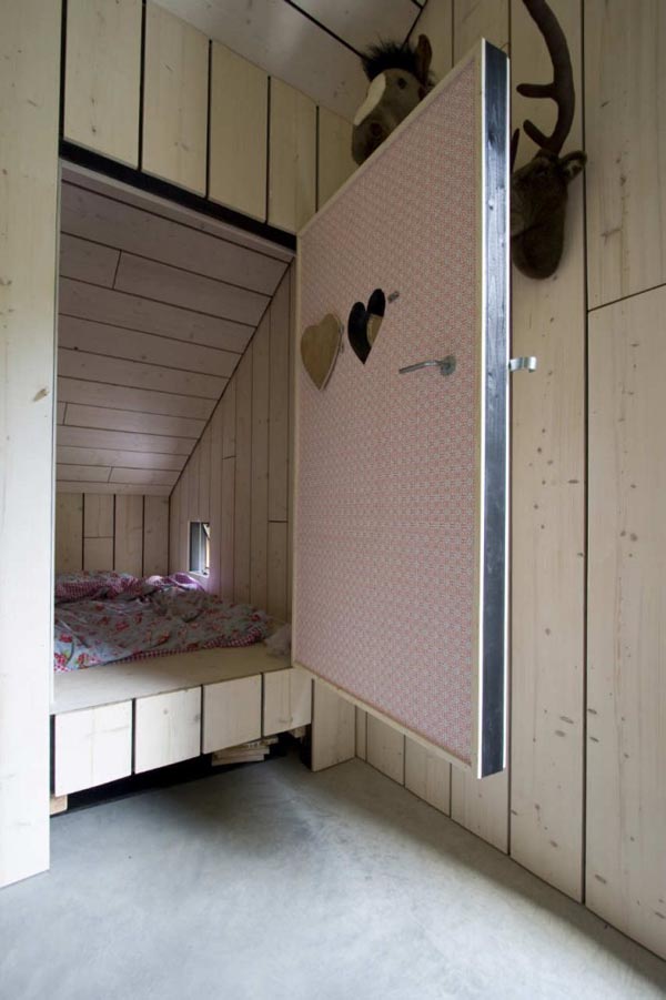 Heart Shaped Bed Funny Heart Shaped Hole In Bed Doors With Wooden Matter Installed With Wooden Striped Wall Inside Chimney House Architecture Elegant Chimney House With Striped Walls And Rectangular Floor Plans