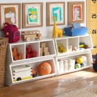 Yellow Giraffe White Funny Yellow Giraffe Sculpture On White Storage Units In Child's Room With Featured Art Projects Beside Bamboo Basket Kids Room Cheerful Kid Playroom With Various Themes And Colorful Design