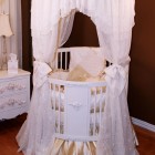 White Round Round Glorious White Round Crib Integrating Round Canopy Completed With Golden Satin Covering The Mattress Kids Room Adorable Round Crib Decorated By Vintage Ornaments In Small Room