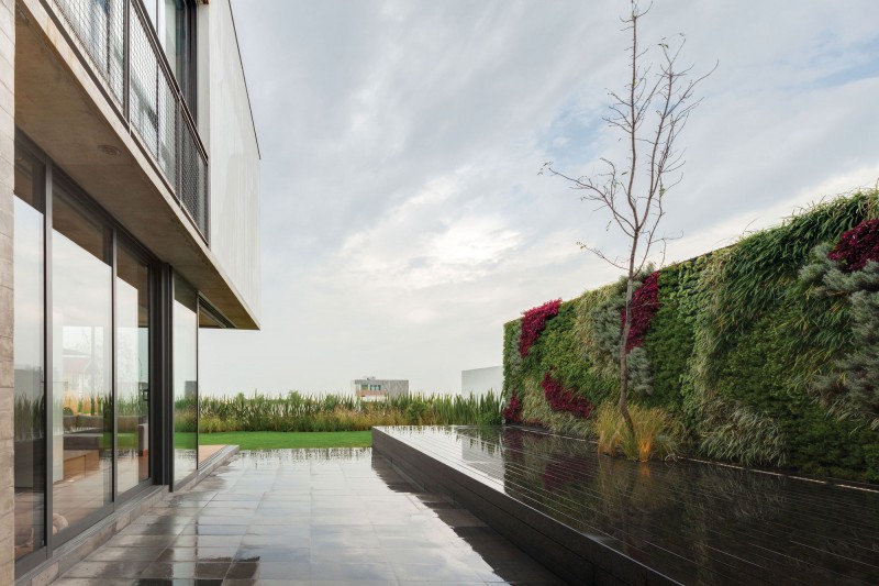 Terrace Area And Glossy Terrace Area With Planters And Reed Covered The Wall In The Valna House That Green Yard Completed The Decor Dream Homes  Swanky Modern House Design For Elegant Dwelling Place