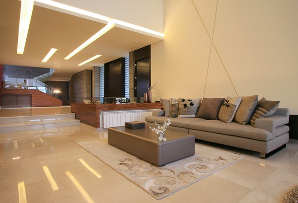 Wooden Floor In Glossy Wooden Floor Feat Carpet In The Living Room In Ghazale Residence That Taupe Sofas Completed The Decor Dream Homes  Wonderful Outdoor Features Ideas Inspired With Modern Style