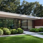 Looking Front With Good Looking Front Yard Beautified With Wooden Striped Wall And Wooden Glass Windows In White Painted Wall Of The New Canaan Residence Dream Homes Charming Modern House With Beautiful Courtyard And Structures