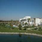 The Reserve Barari Great The Reserve At Al Barari Residence Showing White Wall And Glass Design And The Planters Surrounding The House Decoration Magnificent Furniture And Unique Decoration In Sophisticated Villa