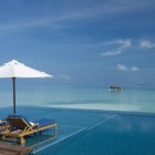 Hotel In Infinity Incredible Hotel In Maldives Integrating Infinity Swimming Pool With Raised Desk For A Couple Of Lounge With Umbrella Swimming Pool Breathtaking Infinity Pool Design To Make Your Dreams Come True