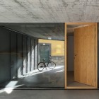 Wooden Door Glass Interesting Wooden Door Design With Glass Wall In Outeiro House Showing Bicycle Which Standing Alone Dream Homes Comfortable And Elegant House In Brown And White Color Schemes