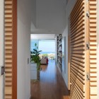 Wooden Striped The Interesting Wooden Striped Wall In The Entrance Artistic Clutter House Installed On The White Wall Painted Wall And Wooden Floor Decoration Surprising Home Decoration With An Open Landscape Of Seaside Views