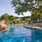 Pool Area Stone Lavish Pool Area Design With Stone And Waterfall That Looks Naturally Add Leafy Tree And Green Vegetation Swimming Pool Amazing Cool Swimming Pool Bringing Beautiful Exterior Style