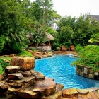 Backyard Landscape Shape Lovely Backyard Landscape With Lake Shape Pool Surrounded By Lush Vegetation And Rustic Pergola At The Corner Swimming Pool Amazing Cool Swimming Pool Bringing Beautiful Exterior Style