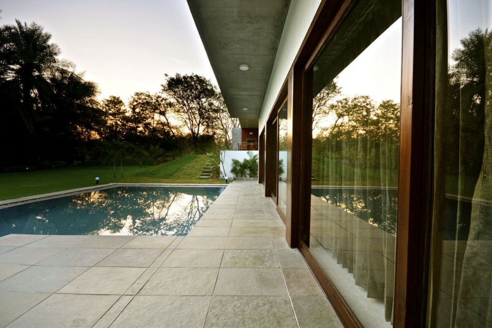 View Of Pool Lovely View Of Home Swimming Pool Area With Lounged And Green Manicured Lawn Surrounded By Leafy Trees Dream Homes Cozy Single Story House With Open Concept Kitchen And Living Rooms