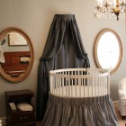 Dark Grey Installed Luxurious Dark Grey Canopy Curtain Installed On Wall To Match Round Crib With Grey Skirt Covering The Legs Kids Room Adorable Round Crib Decorated By Vintage Ornaments In Small Room
