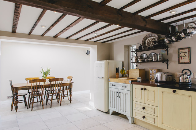 Farmhouse Kitchen Ceiling Modern Farmhouse Kitchen With Beams Ceiling And Cream Kitchen Cupboards Paint Applied Hanging Storage And Dark Top Counter Kitchens  Fantastic Kitchen Cupboards Paint Ideas With Chic Cupboards Arrangements