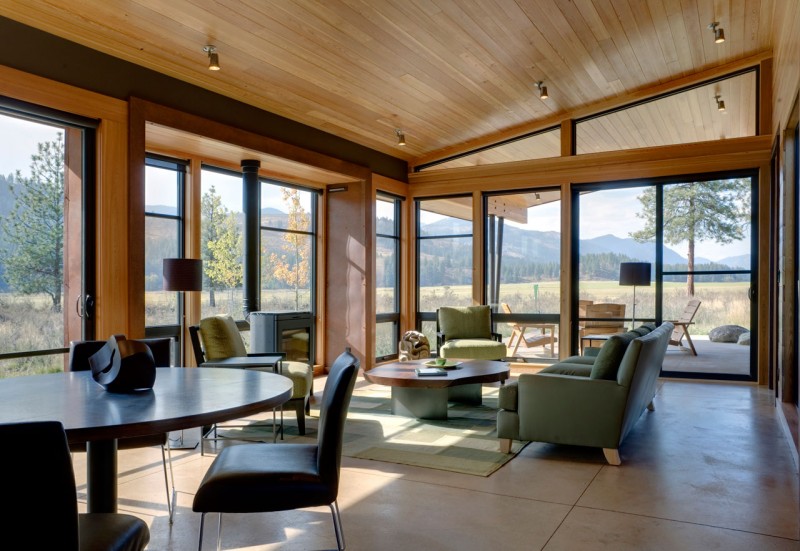 Living Room Green Neat Living Room Design With Green Chairs Feat Wooden Table In Wolf Creek Residence That Glass Wall Decoration Decoration Fabulous Contemporary Cabin Among The Beautiful Scenery View