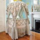 Round Crib Blue Neutral Round Crib Covered By Blue And Cream Linen To Cover The Canopy Warmed By Classic Fireplace Kids Room Adorable Round Crib Decorated By Vintage Ornaments In Small Room