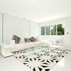 Family Room White Pretty Family Room Of Sleek White Contemporary Villa In Madrid Decorated With Flower Patterned Rug Under White Sectional Sofa Apartments Sophisticated Scandinavian Living Rooms As Inspirational Design For You