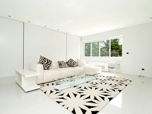 Family Room White Pretty Family Room Of Sleek White Contemporary Villa In Madrid Decorated With Flower Patterned Rug Under White Sectional Sofa Apartments Sophisticated Scandinavian Living Rooms As Inspirational Design For You