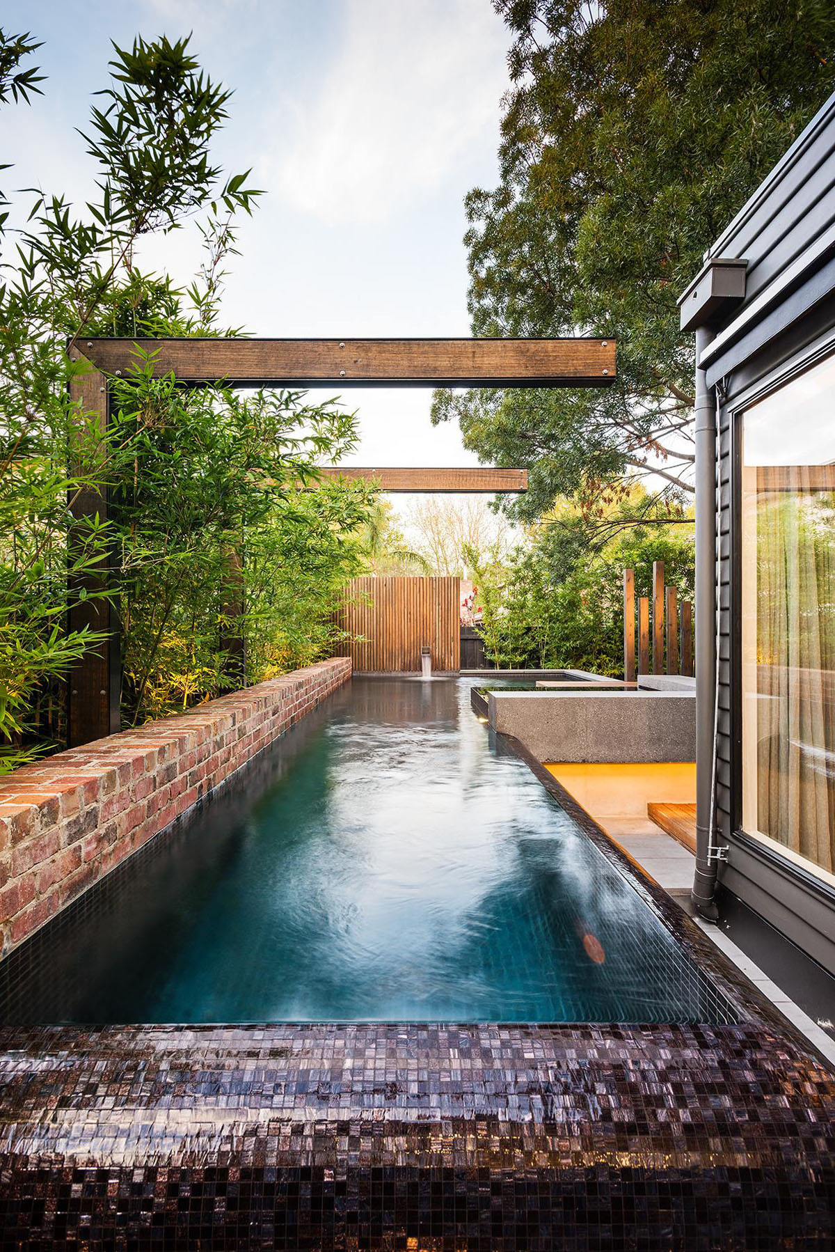 Backyard Landscape Swimming Refreshing Backyard Landscape With Long Swimming Pool Applied Brick Wall Fence At Maroon Modern Backyard Project Decoration  Beautiful Modern Backyard Ideas To Relax You At Charming Home