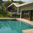 Inground Swimming Surrounded Refreshing In Ground Swimming Pool Idea Surrounded By Gravels And Green Manicured Lawn Enjoyed From Home Interior Dream Homes Cozy Single Story House With Open Concept Kitchen And Living Rooms