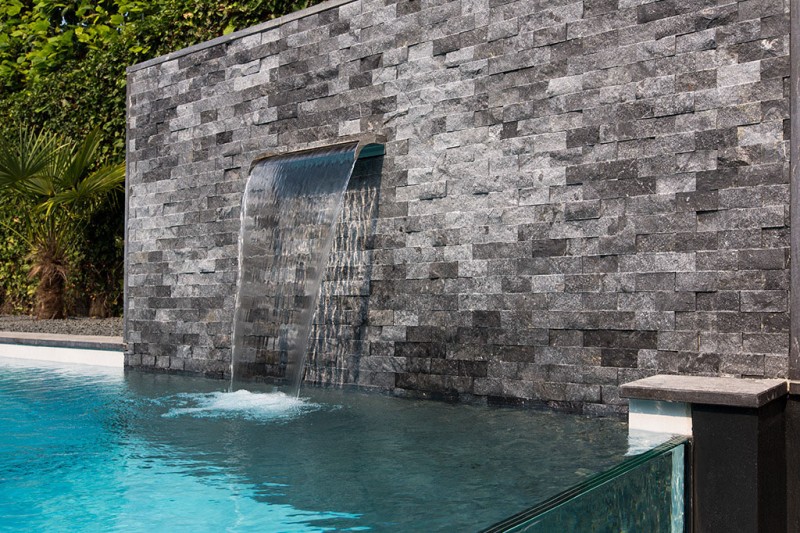 Vertical Waterfall Stone Relaxing Vertical Waterfall Installed On Stone Tiled Wall In Dream Backyard Home Swimming Pool With Infinity Concept Swimming Pool  Beautiful Pool Backyard For Luxury And Fresh Backyard Look