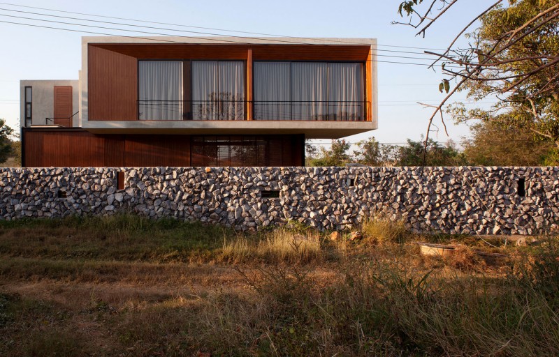 Stone Garden Modern Rustic Stone Garden Wall Surrounding Modern Architectural W House With Transparent Glass Wall Small Balcony With Dark Metallic Railing Architecture  Elegant Concrete Home With Spacious And Modern Style In Thailand