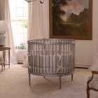 Grey Painted Without Simple Grey Painted Round Crib Without Canopy Placed On Center Of Room With Tall Painting On Center Wall Kids Room Adorable Round Crib Decorated By Vintage Ornaments In Small Room