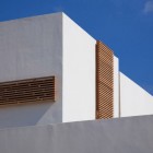 White Painted On Simple White Painted Wall Installed On The Artistic Clutter House Furnished With Unique Wooden Striped Perforated Windows Decoration Surprising Home Decoration With An Open Landscape Of Seaside Views