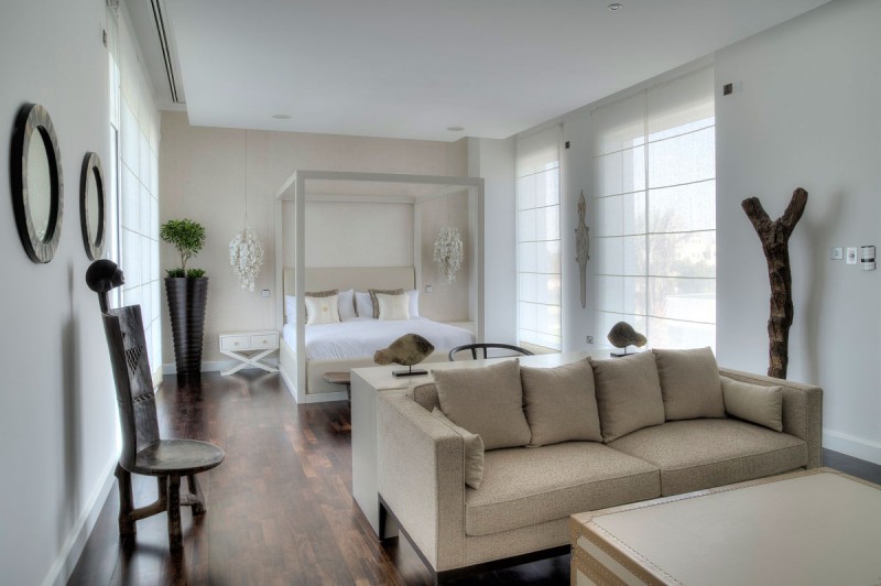 Bedroom Beside Sofas Sleek Bedroom Beside The Living Sofas In Taupe Color Beside The Black Chairs At The The Reserve At Al Barari Residence Decoration Magnificent Furniture And Unique Decoration In Sophisticated Villa