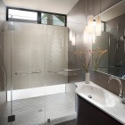 White Floor Shower Sleek White Floor Tile In Shower Cabin With Glass Wall Floating Bathroom Vanity Shiny Pendant Lights Quarry Street House Marina Rubina Decoration Stylish Contemporary Prefab House With Industrial Wooden Furniture
