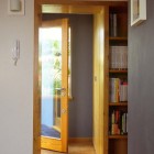 Modern Entry Woodframe Striking Modern Entry With Bookshelf Wood Frame Glass Door 12AP Project Decoration Fancy House Style In Fascinating Sporadic Color Scheme