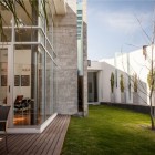 White Dry Green Stunning White Dry Tree On Green Large Turfs In Casa Villa De Loreto Residence Beside White Wooden Glass Windows Dream Homes Spacious Modern Concrete House With Steel Frame And Glass Elements