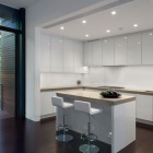 White Island Whote Stylish White Island And Double White Stools In The Kitchen Completed With White Cabinets Of The New Canaan Residence Dream Homes Charming Modern House With Beautiful Courtyard And Structures