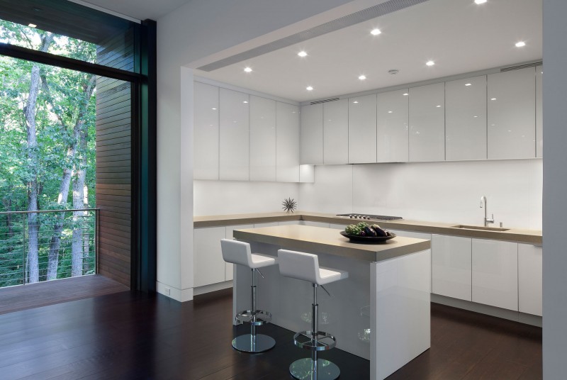 White Island Whote Stylish White Island And Double White Stools In The Kitchen Completed With White Cabinets Of The New Canaan Residence Dream Homes Charming Modern House With Beautiful Courtyard And Structures