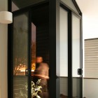 Contemporary Dark Door Super Contemporary Dark Sliding Glass Door Installed To Access Staircase Inspired By Public Telephone Box On Street Decoration Fresh House Decoration In Summer Theme