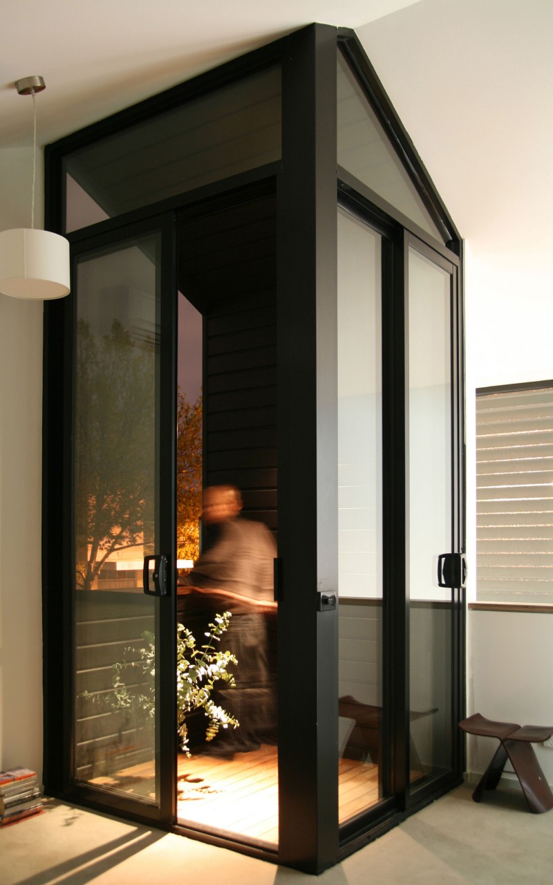 Contemporary Dark Door Super Contemporary Dark Sliding Glass Door Installed To Access Staircase Inspired By Public Telephone Box On Street Decoration Fresh House Decoration In Summer Theme