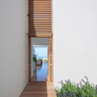 Wooden Striped Near Terrific Wooden Striped Center Wall Near Entrance Installed With Wooden Striped Floor In White Painted Wall Of Artistic Clutter House Decoration Surprising Home Decoration With An Open Landscape Of Seaside Views (+19 New Images)