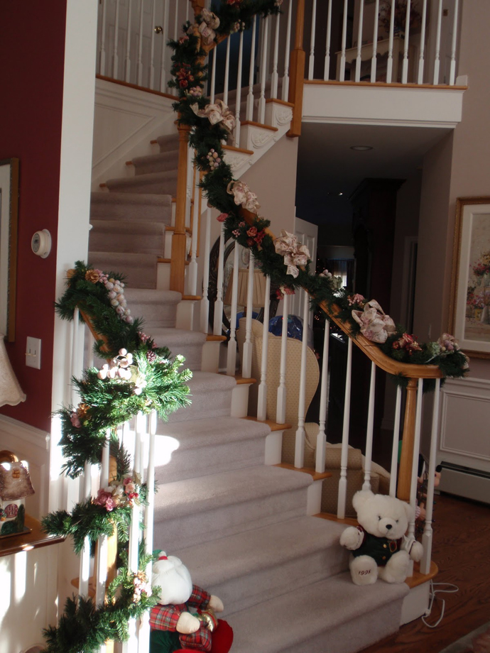Staircase Christmas Along Traditional Staircase Christmas Decor Installed Along The Circular Staircase With Greenery Attached On The Balustrade  Magnificent Christmas Decorations On The Staircase Railing