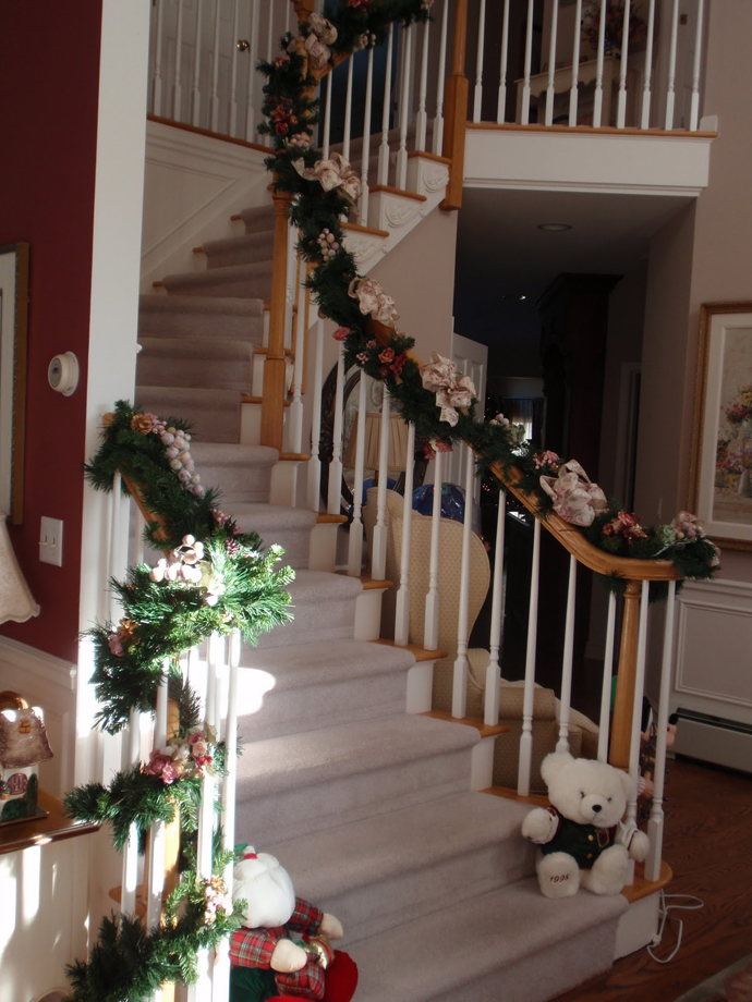 Staircase Christmas Along Traditional Staircase Christmas Decor Installed Along The Circular Staircase With Greenery Attached On The Balustrade Dream Homes Magnificent Christmas Decorations On The Staircase Railing