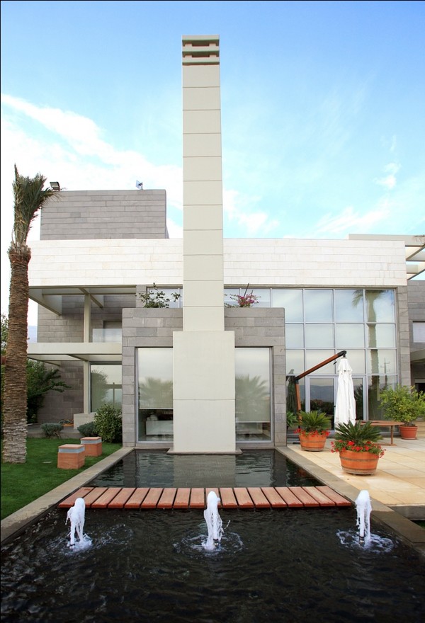 Facade View Residence Wonderful Facade View By Ghazale Residence With Steel And White Wall Themed That Fresh Water Feat Planters That Accompany The Area Dream Homes  Wonderful Outdoor Features Ideas Inspired With Modern Style