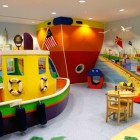 Twd Ship Playroom Wonderful Modern Ship Themed Child's Playroom Ferris Wheel Harbour Involved Kids Chairs On Modular Wooden Table Kids Room Cheerful Kid Playroom With Various Themes And Colorful Design