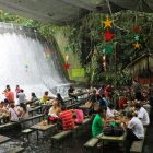 Escudero Waterfall Dining Amazing Escudero Waterfall Restaurant Including Dining Space Nearby Waterfall With Wooden Dining Table And Bench Also Stars Ornament On Ceiling Restaurant Unique Villa Design Providing Stunning Unusual Experience