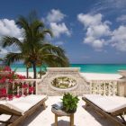 Sea View The Amazing Sea View Enjoyed From The Coral House On Grace Bay Sun Room Area With A Couple Of Lounge With Table Architecture Luminous Private Beach House With Stylish And Chic Exotic Interiors